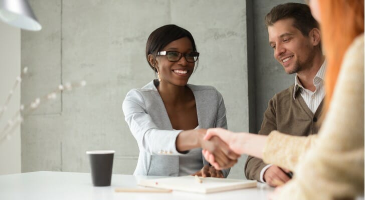 Clients meeting with their new financial advisor.